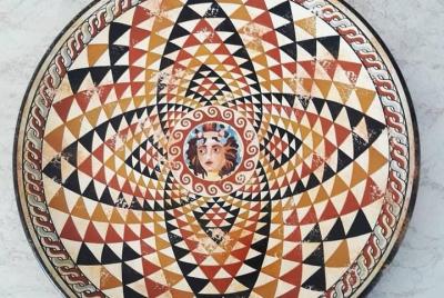 Pintura que representa a Dios Dioniso coronado con hiedra en su animal sagrado